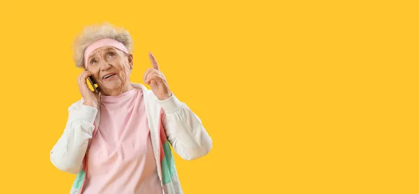 Senior Woman Talking Mobile Phone Yellow Background Space Text — Stock Photo, Image