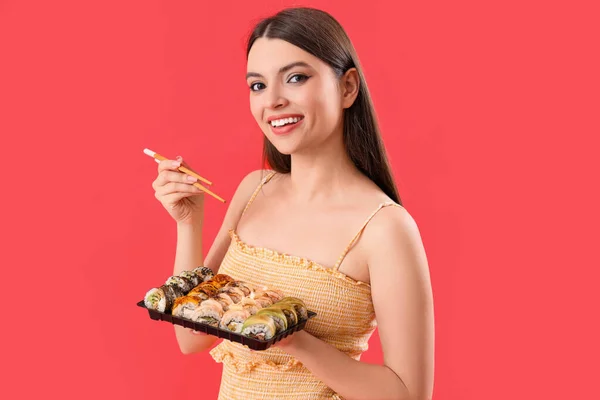 Young Woman Sushi Red Background — Stock Photo, Image