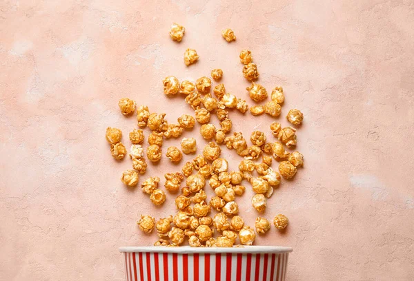 Stock image Bucket with tasty popcorn on pink background