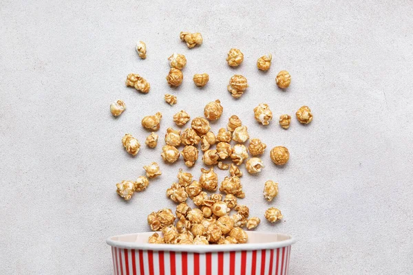 stock image Bucket with tasty popcorn on white background