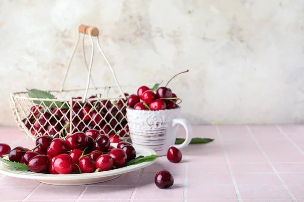 Plate Basket Cup Sweet Cherries Pink Tile Table — Stock Photo, Image