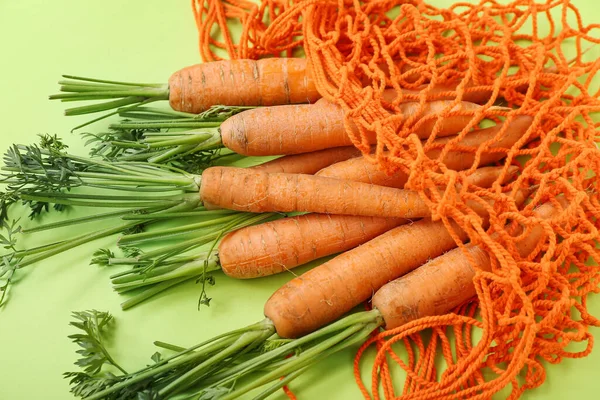 String Bag Fresh Carrots Green Background — Stock Photo, Image