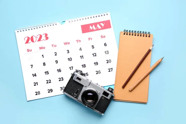 Composition Calendar Photo Camera Notebook Pencils Blue Background — Stock Photo, Image