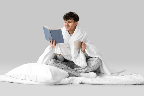 Handsome Happy Man Cup Coffee Soft Blanket Pillow Reading Book — Stock Photo, Image