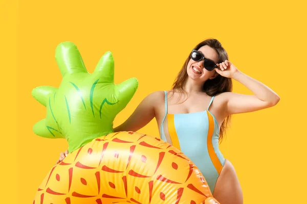 Young Woman Swim Ring Shape Pineapple Yellow Background — Stock Photo, Image