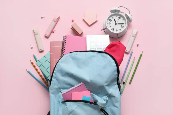 Blue School Backpack Notebooks Alarm Clock Pencils Pink Background — Stock Photo, Image