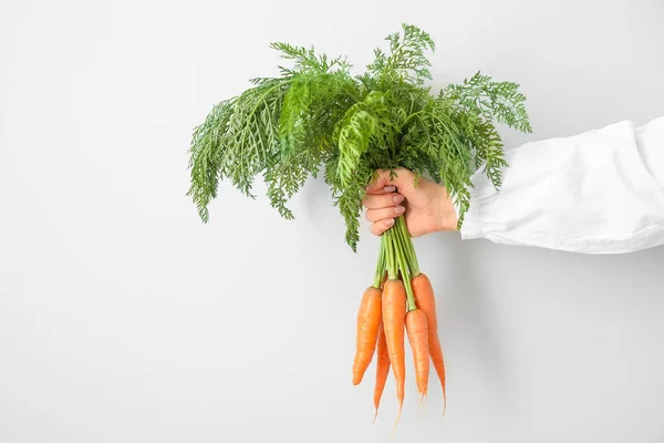Woman Holding Bunch Fresh Carrots Leaves Light Background — Stock Photo, Image