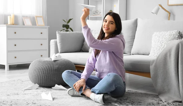 Happy Young Woman Throwing Paper Plane Home — Stock Photo, Image