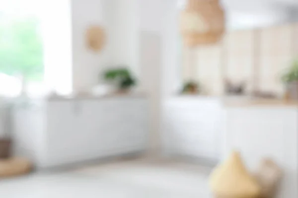 stock image Blurred view of light kitchen with white counters