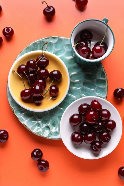 Plates Cup Sweet Cherries Orange Background — Stock Photo, Image