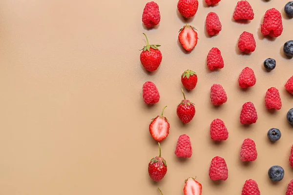 stock image Fresh raspberries, blueberries and strawberries on beige background