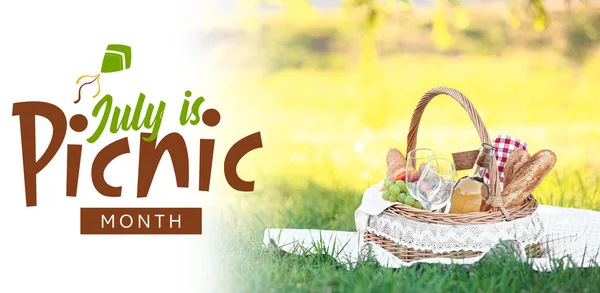 stock image Banner for National Picnic Month with tasty food and wine in basket outdoors