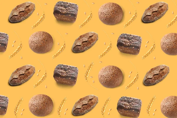 stock image Pattern with tasty bread loaves and rye ears on yellow background