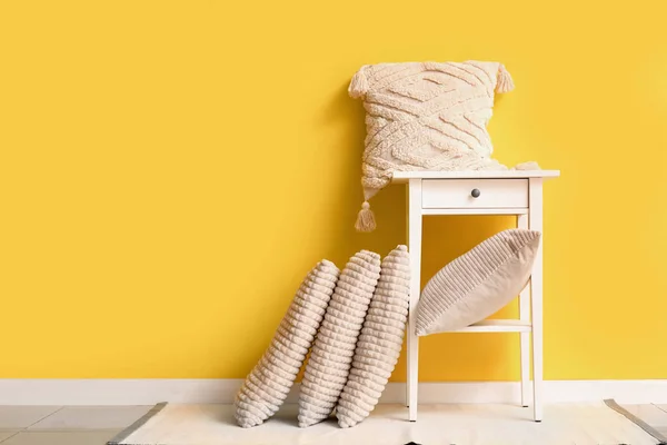Table Stylish Pillows Yellow Wall Room — Stock Photo, Image