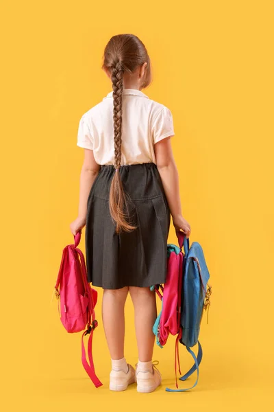 Little Schoolgirl Backpacks Yellow Background Back View — Stock Photo, Image