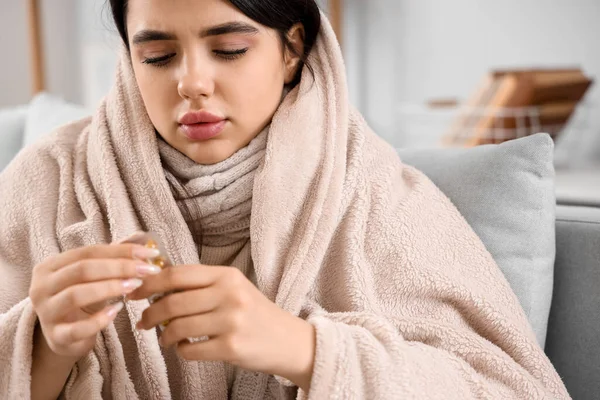 stock image Sick woman with pills at home