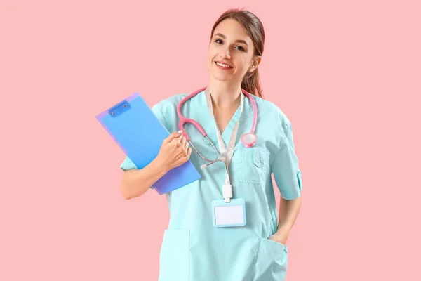 Female Medical Intern Clipboard Pink Background — Stockfoto