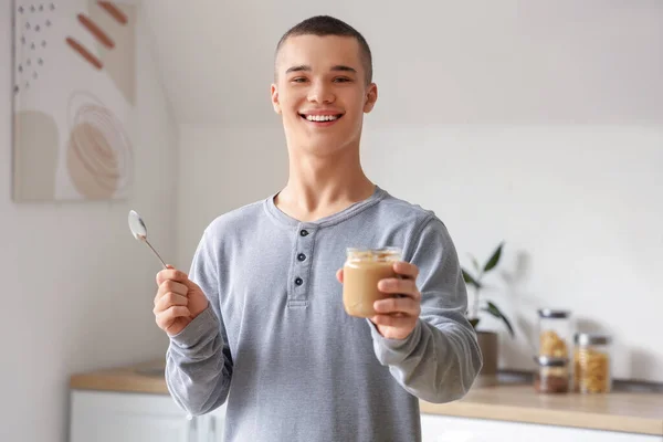Happy Young Man Tasty Nut Butter Kitchen — Stock Photo, Image