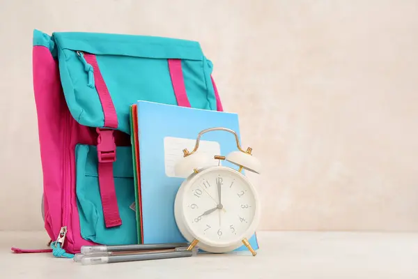 Backpack Alarm Clock Different Stationery White Table — Stock Photo, Image
