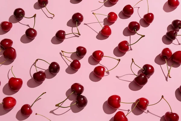 stock image Many sweet cherries on pink background