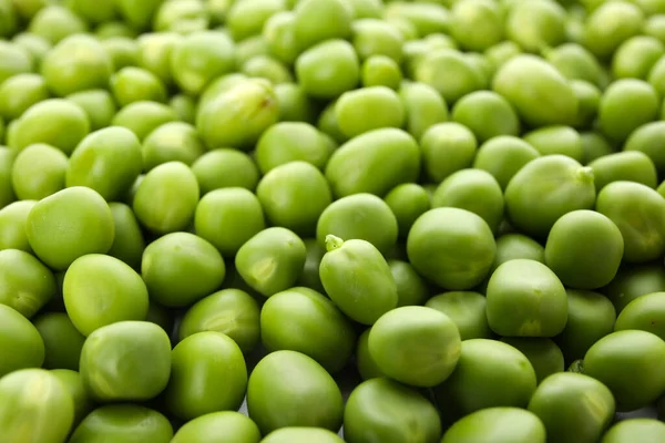 新鮮な緑のエンドウ豆の質感を背景に — ストック写真