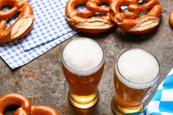 stock image Flag of Bavaria, mugs with beer and pretzels on dark background