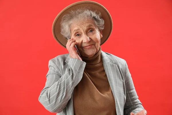 Senior Woman Talking Mobile Phone Red Background — Stock Photo, Image