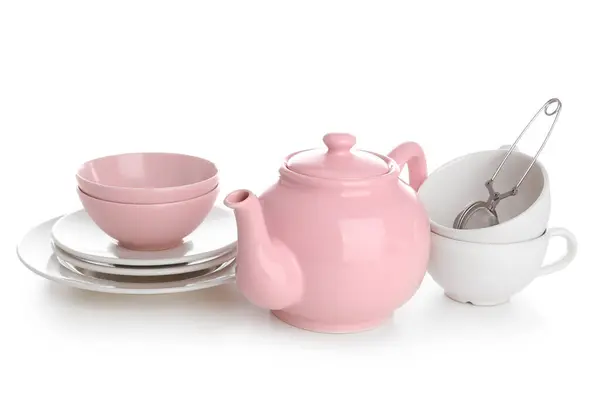 stock image Ceramic teapot with cups, tea infuser and saucers on white background