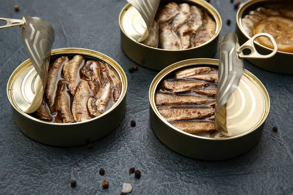Opened Tin Cans Sprats Oil Black Table — Stock Photo, Image