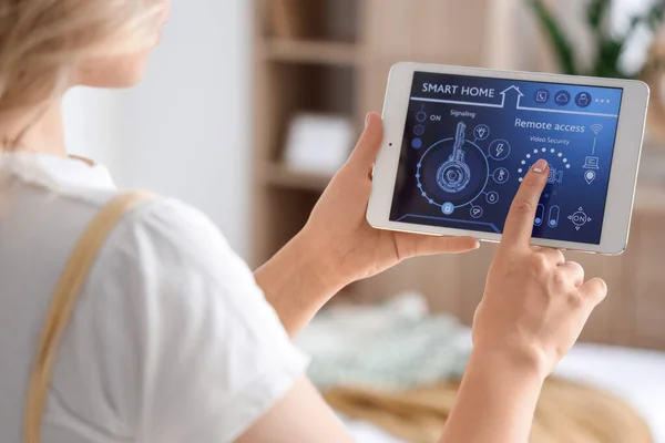 Young Woman Using Smart Home Security System Control Panel Bedroom — Stock Photo, Image