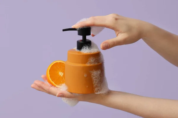Hands Liquid Soap Orange Lilac Background — Stock Photo, Image