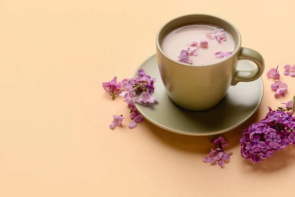 Cup Coffee Beautiful Lilac Flowers Beige Background Closeup — Stock Photo, Image