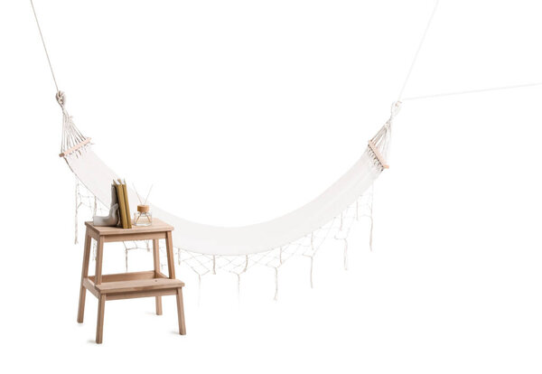 Cozy hammock, stepladder with books and reed diffuser isolated on white background