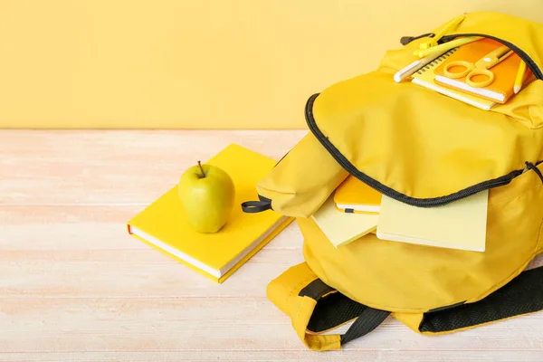 Yellow School Backpack Notebooks Apple Scissors Wooden Table Wall — Stock Photo, Image