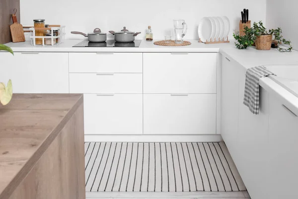 stock image Stylish striped rug in interior of modern kitchen