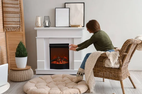 Young Woman Warming Hands Armchair Fireplace Home — Stock Photo, Image