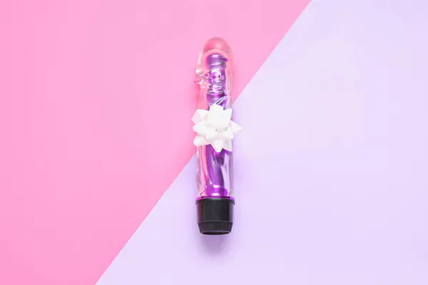 stock image Vibrator with beautiful bow on color background