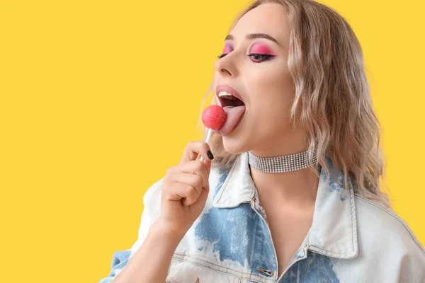 Young Woman Eating Lollipop Yellow Background Closeup — Stock Photo, Image