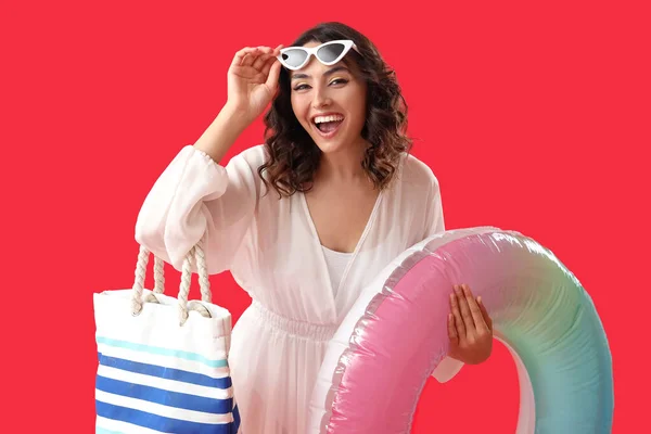 Young Woman Beach Bag Inflatable Ring Red Background — Stock Photo, Image