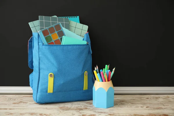 Blue School Backpack Notebooks Cup Pencils Markers Wooden Table Black — Stock Photo, Image