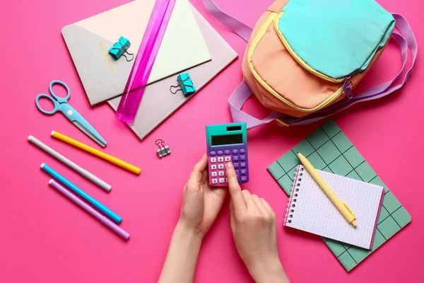 Woman Different Stationery Backpack Using Calculator Pink Background — Stock Photo, Image
