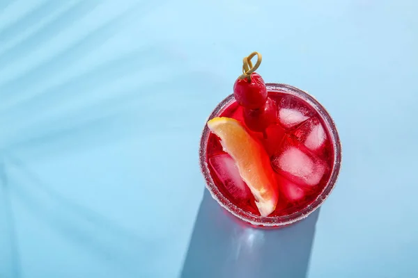 Glass Tasty Cocktail Maraschino Cherries Blue Background — Stock Photo, Image