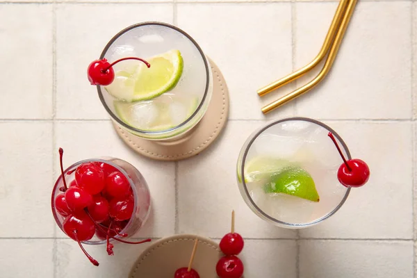 Glasses Tasty Cocktail Maraschino Cherries White Tile Background — Stock Photo, Image