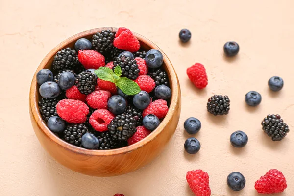 stock image Bowl with different fresh berries on beige background, closeup