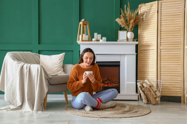 Young Woman Drinking Hot Tea Fireplace Home — Stock Photo, Image