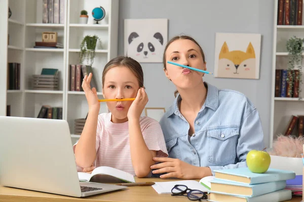 Cute Little Girl Her Mother Having Fun While Doing Lessons — Stock Photo, Image