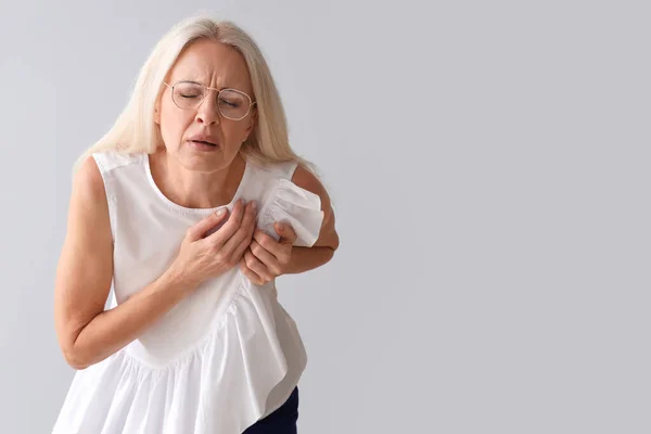 Mature Woman Having Heart Attack Grey Background — Stock Photo, Image