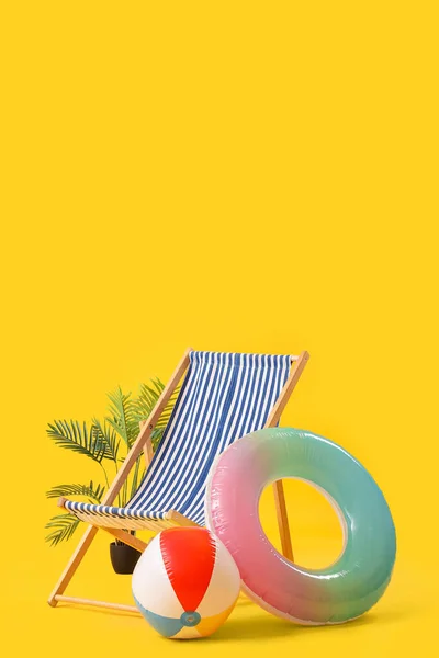 Deck Chair Beach Ball Inflatable Ring Palm Tree Yellow Background — Stock Photo, Image