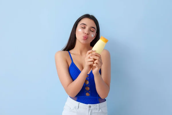 Beautiful Young Woman Sunscreen Cream Blowing Kiss Light Background — Stock Photo, Image