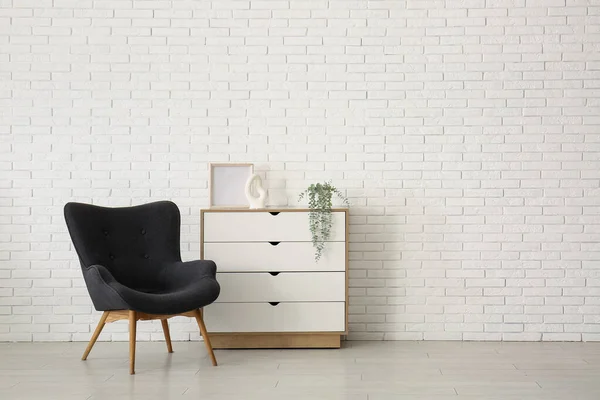 Stylish Black Armchair Chest Drawers White Brick Wall — Stock Photo, Image